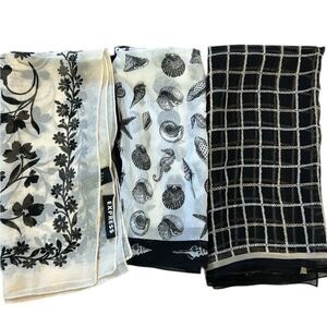 Three black and white silk or polyester square scarves